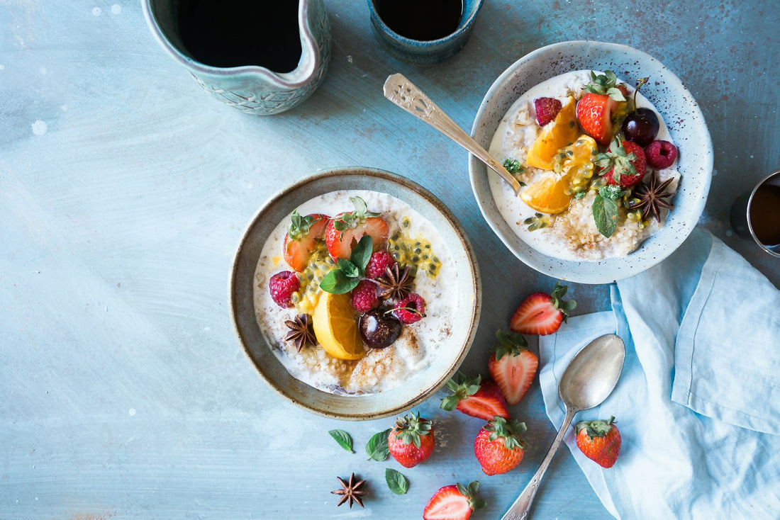 Bowls of oats and fruit for gut health
