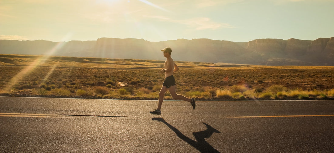 Runner jogging at a steady pace on a road