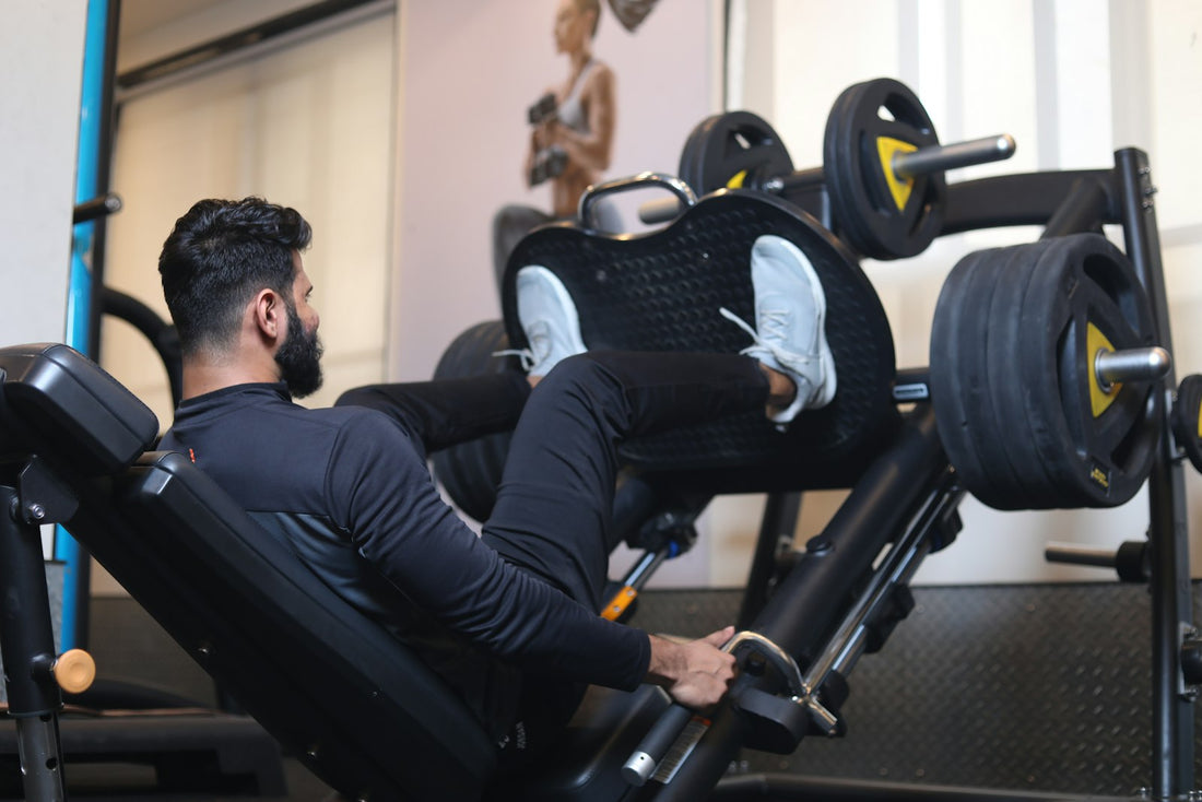 Person using a gym resistance machine