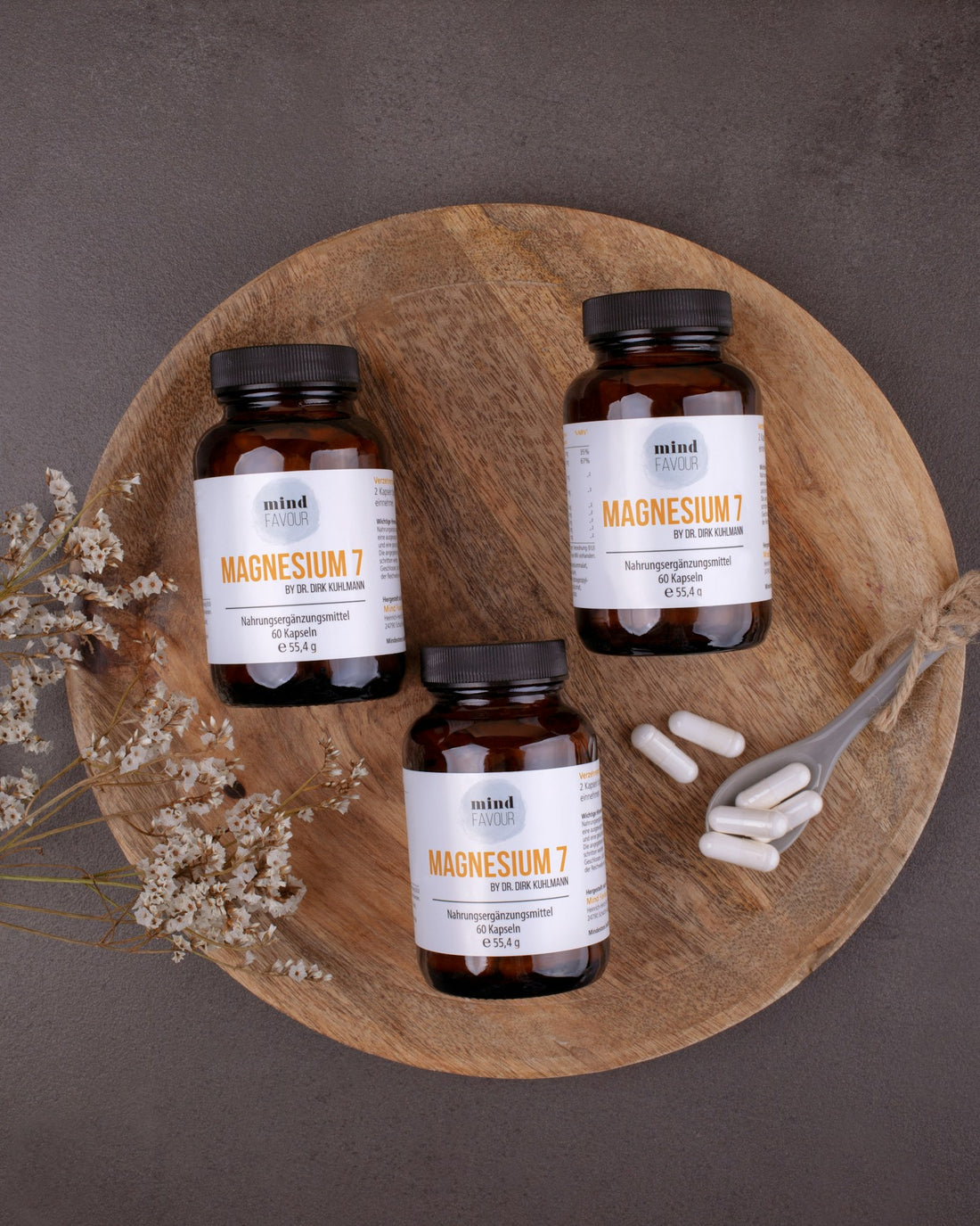 Magnesium supplement bottles on a wooden surface