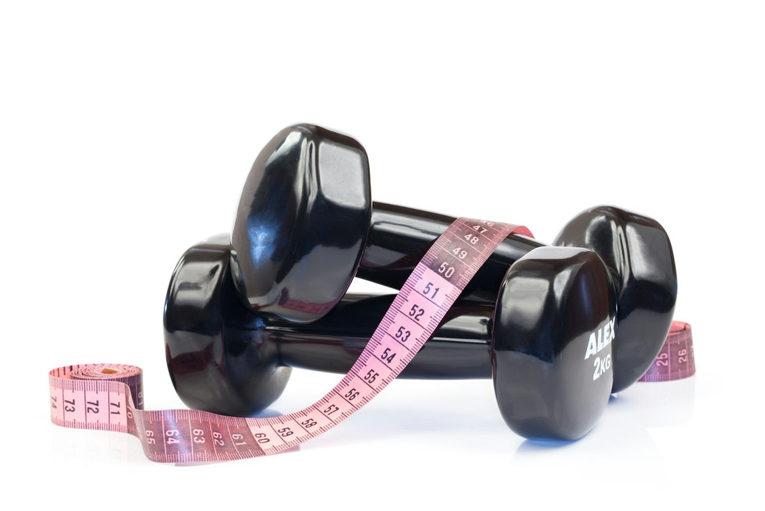 Dumbbells wrapped with a measuring tape