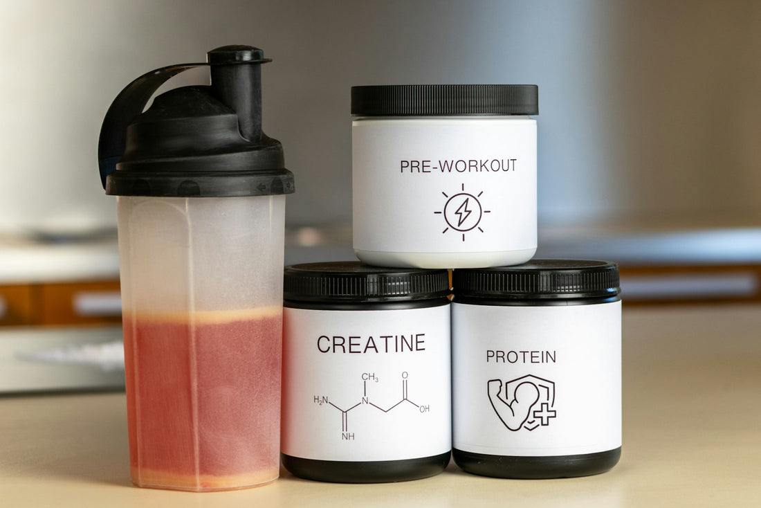Supplement tubs beside a blender