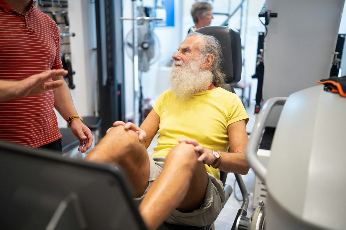 Older man strength training in a gym