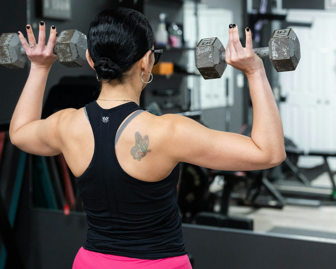 Woman strength training with dumbbells