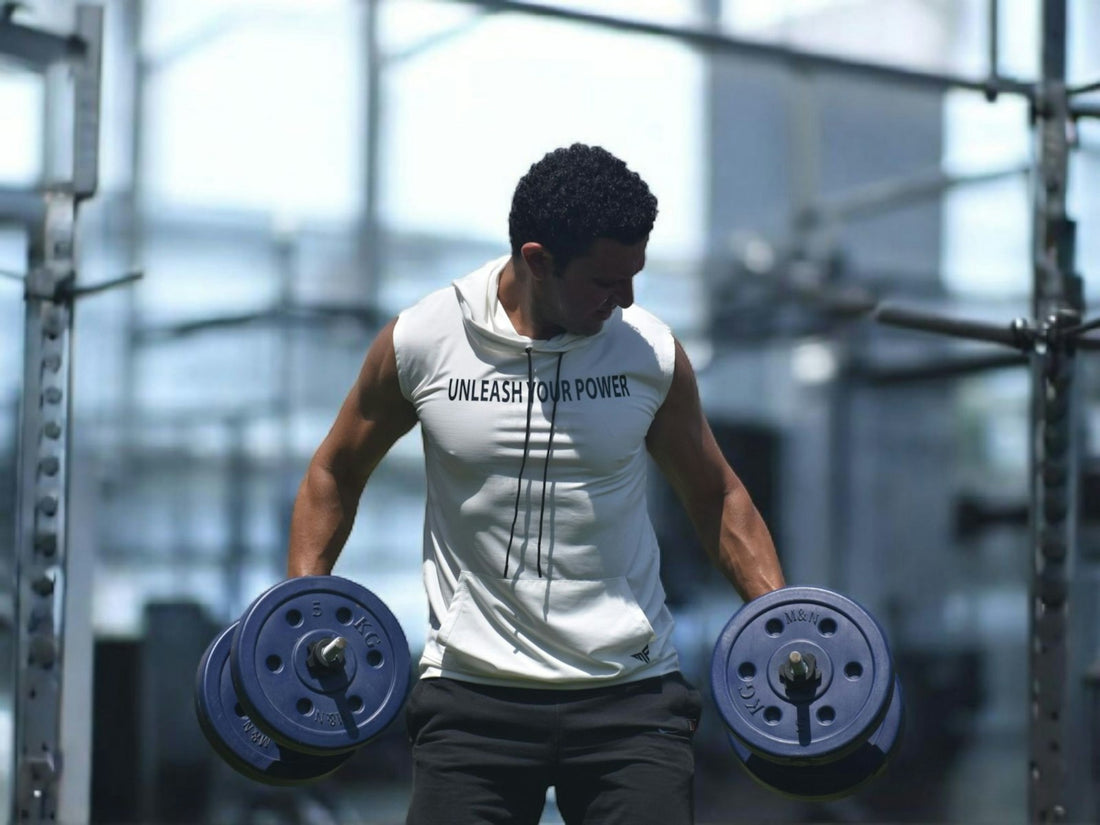Man lifting dumbbells during a gym strength workout