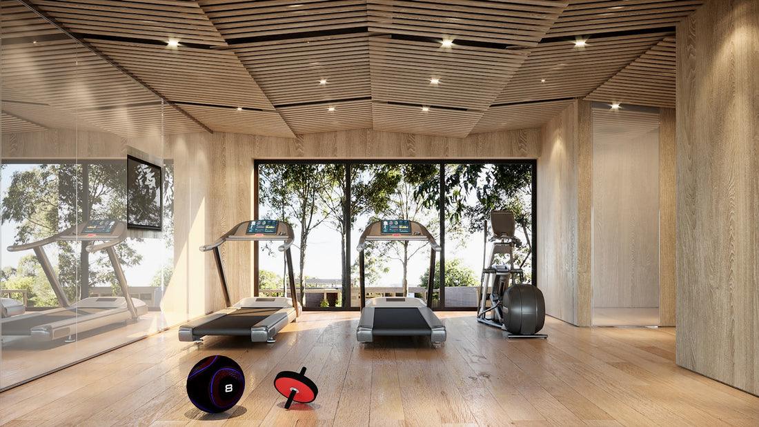 A bright modern gym with treadmills and large windows looking out to trees