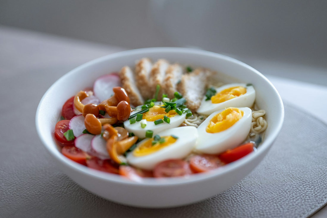 A bright bowl of chicken, eggs and vegetables, a high-protein meal