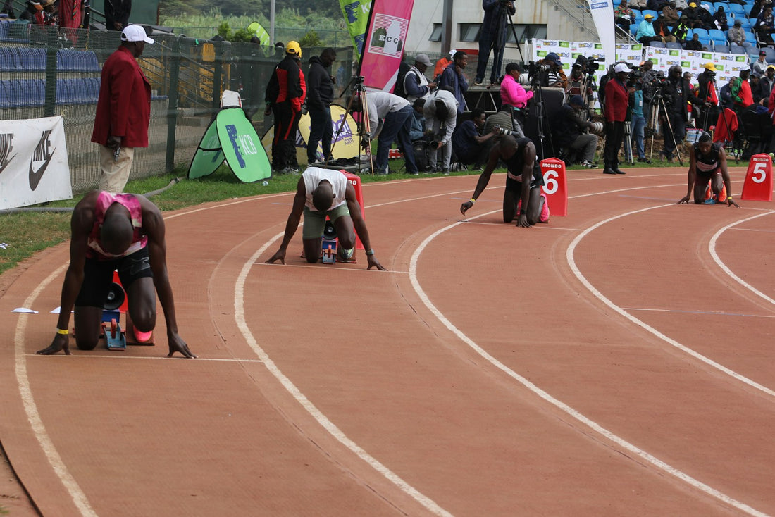 Sprinters in starting blocks on a track