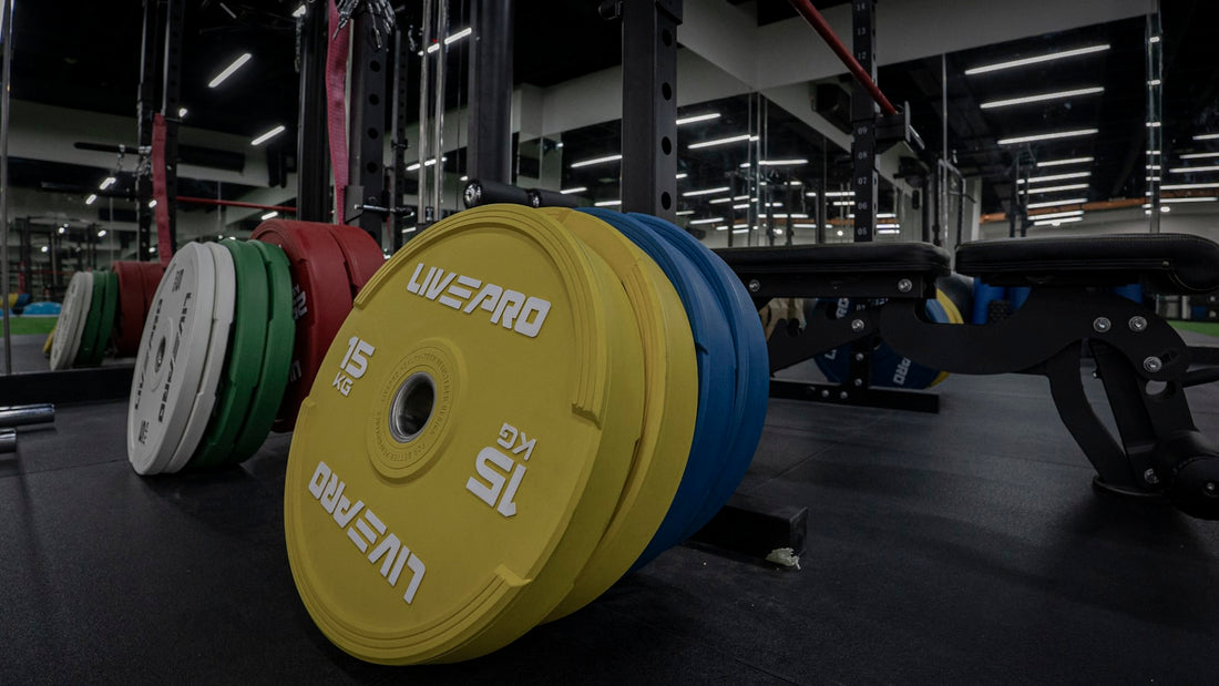 Weight plates stacked in a gym